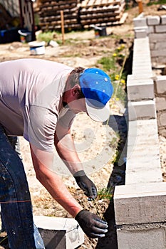 Builder working on new walls