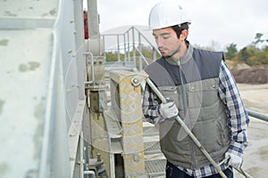 Builder working outside factory