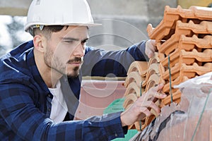 Builder working on roof new building