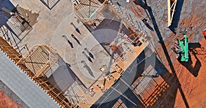 Builder working on roof of new house residential building under construction