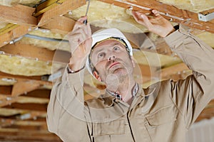 builder working on wood ceiling