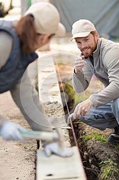 builders building cement wall