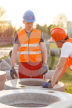 Builders and concrete pipes