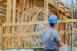 Builders on construction site new home under construction