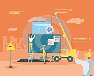 builders and desktop with webpage under cosntruction photo