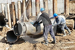 Builders with equipment for piling photo