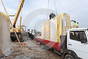 Builders Installing Frame House Structural Insulated SIP Panels. Building New Frame House.