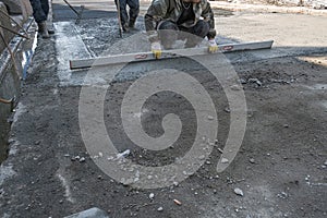 Builders poured concrete at the construction site