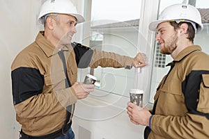 Builders relaxing during break on site