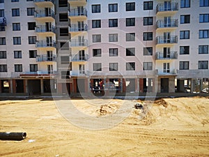 builders rest after construction work on painting the facade at the construction site. Construction of apartments in a