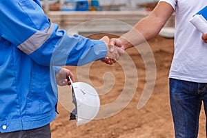 Builders shaking hands