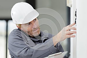 builders with tablet pc and equipment indoors