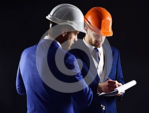 Builders think about engineering project.