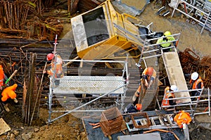 Builders work in construction building site