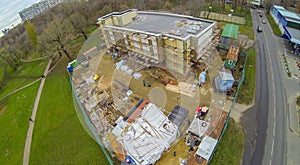 Builders are working on cladding of the building,