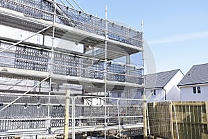 Building affordable homes with scaffolding safety by local construction council to help government social housing problem and shor