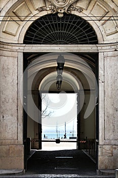 Building archway overlooking the Tagus River in Lisbon