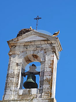 Arco da Vila, gate to the old town of Faro in Portugal, historic building with stork nest