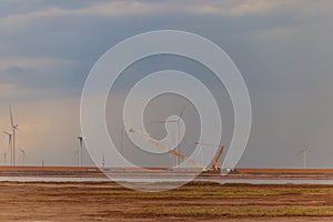 Building and assembling construction wind turbines farm by a crane