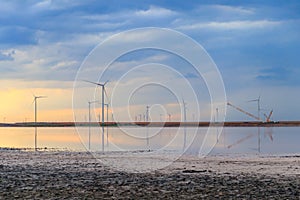 Building and assembling construction wind turbines farm by a crane