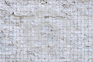 Building background prepared surface of the facade wall of the building with a fixed rusted mesh for cementing and