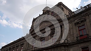 Building with baroque architecture from Mexico City under slightly cloudy sky