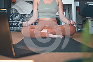 Building a better body image through yoga. Closeup shot of a woman meditating while practising yoga at home.