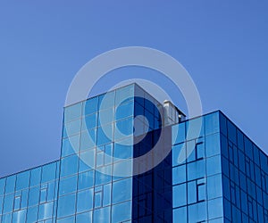 Building with blue windows against the blue sky