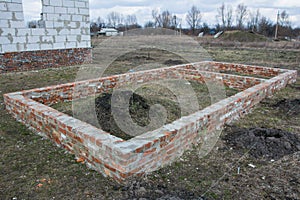 Building Brick foundation of new house construction