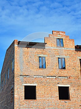 Building brick house construction wall with windows installation