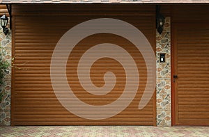 Building with brown roller shutter garage door