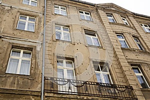 Building with bullet holes of war