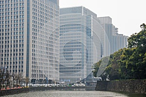 Building in business area side of canel in the cloudy day. Tokyo