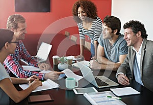 Building the business together. Shot of a group of colleagues having a meeting in a boardroom.