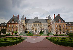 Building of Cite internationale universitaire de Paris with green landscape in Paris, France