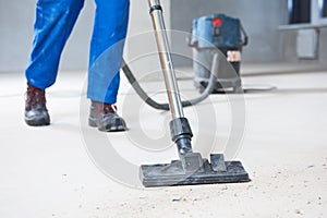 Building cleaning service. dust removal with vacuum cleaner