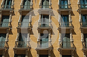 Building with colorful facade and closed windows in Madrid