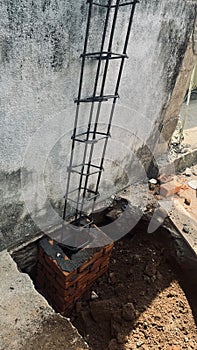 Building column protected by cemented red bricks photo