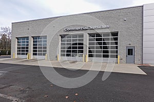 Building with a commercial vehicle repair shop with four garage doors