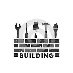 Building concept with wall and tools