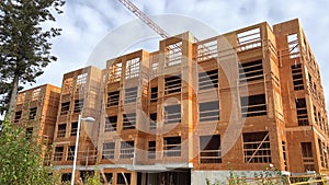 building construction in canada vancouver wooden house frame unfinished construction thin walls crane summer housing