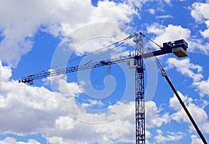 Building construction crane against blue sky