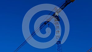 Building.Construction crane. Construction machinery on blue sky background. New house construction.