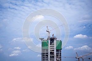 Building construction crane on sky background, construction site
