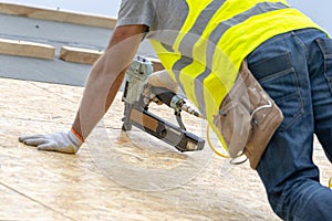 Building construction process of new wooden roof on wood frame house