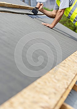 Building construction process of new wooden roof on wood frame house