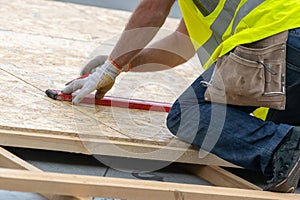 Building construction process of new wooden roof on wood frame house