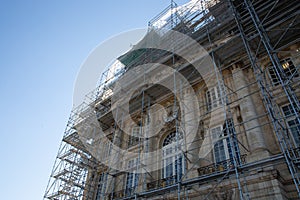 Building Construction With Scaffolding site in blue sky