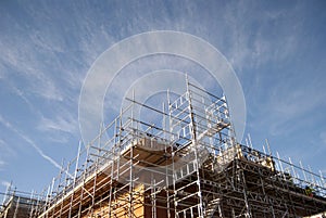 Building construction site, blue sky with clouds background.