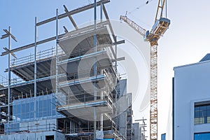 Building construction site with a crane in Auckland, New Zealand